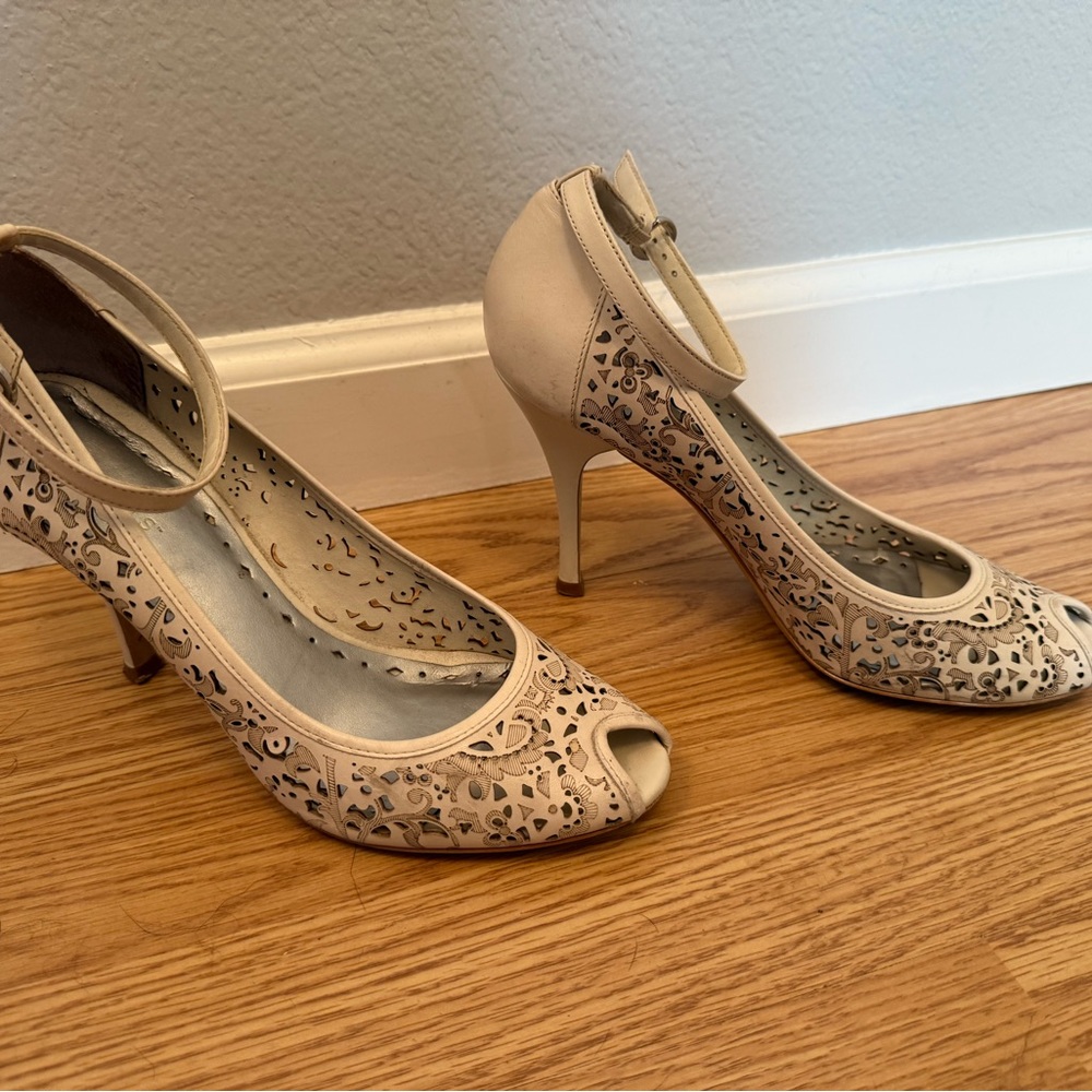 BCBGirls Cream Peep-Toe Heels with Cutout Pattern